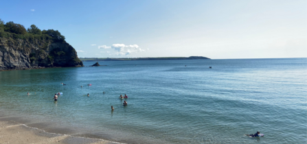 Picture shows a sunny day on the south coast of cornwall with water users enjoying the sea within st austell bay