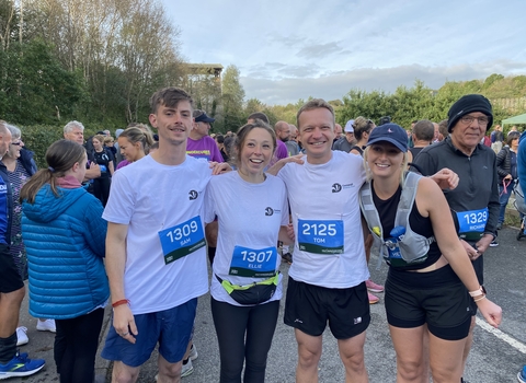 A group of four marathon runners supporting each other at the Eden Marathon